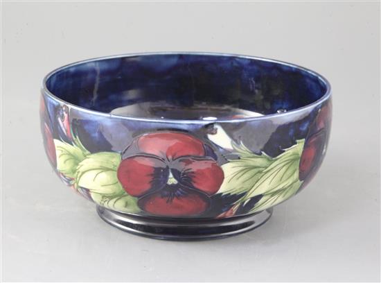 A Moorcroft pansy pattern bowl, diameter 8.25in.